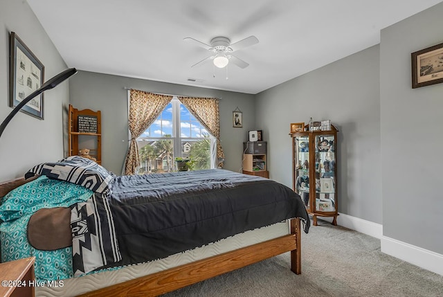 bedroom with a ceiling fan, carpet, visible vents, and baseboards