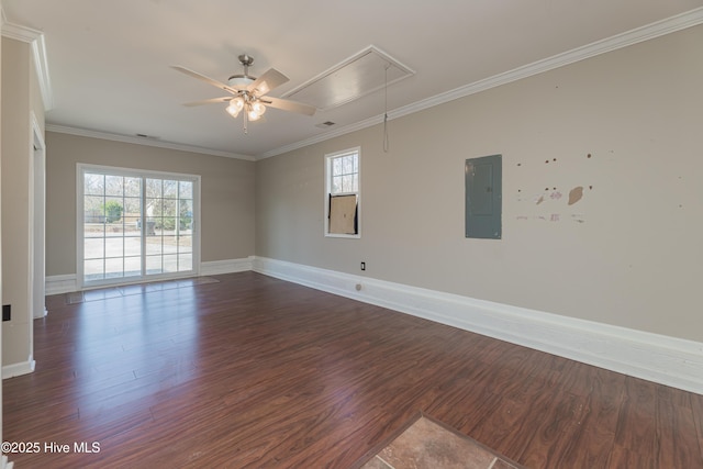 empty room with electric panel, ceiling fan, dark hardwood / wood-style floors, and ornamental molding