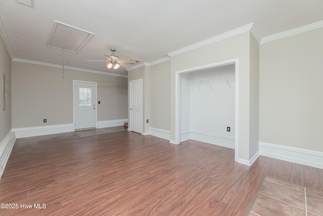 spare room featuring hardwood / wood-style flooring, ceiling fan, and ornamental molding