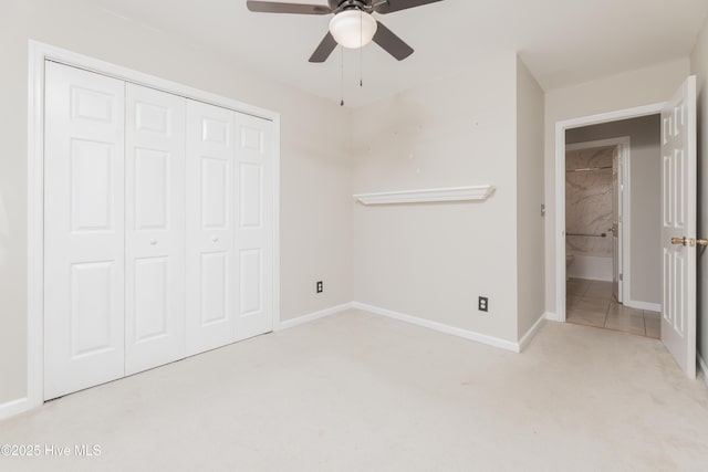 unfurnished bedroom with a closet, ceiling fan, and light colored carpet