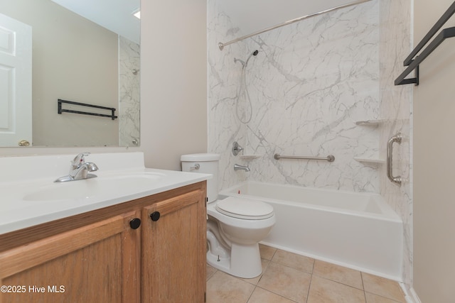 full bathroom with tile patterned flooring, vanity, toilet, and tiled shower / bath