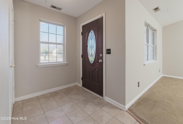 entryway featuring light tile patterned floors