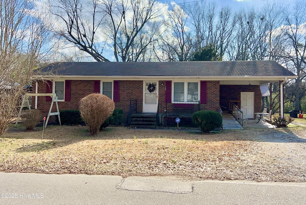 ranch-style home with a front lawn