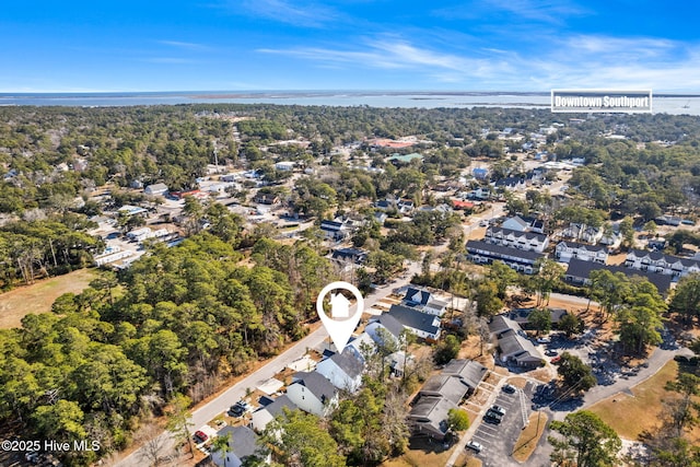 1163 N Caswell Ave, Southport, NC 28461 - aerial view of property and surrounding area featuring nearby suburban area and a large body of water