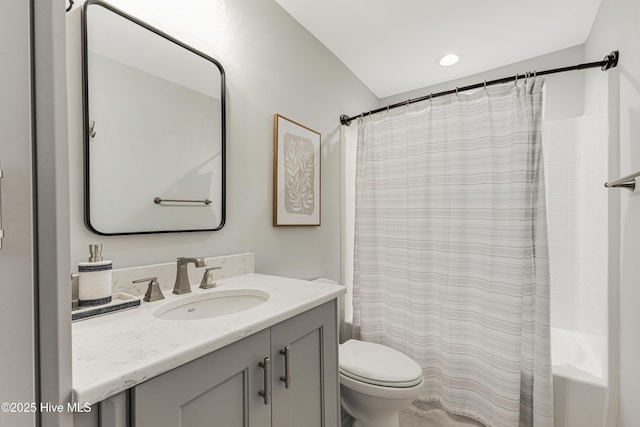 full bathroom with toilet, vanity, and shower / tub combo with curtain