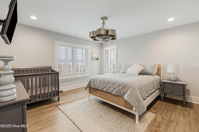 bedroom with hardwood / wood-style flooring