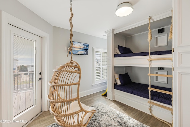 bedroom with baseboards and light wood finished floors