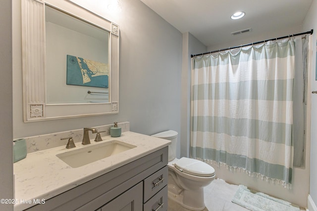 full bath featuring a shower with curtain, visible vents, toilet, vanity, and tile patterned flooring