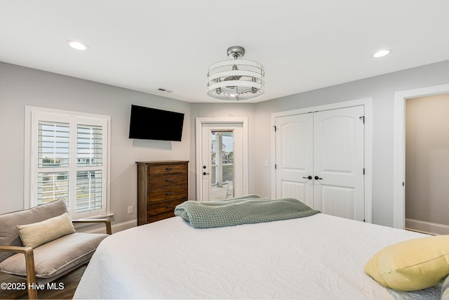 bedroom featuring baseboards, a closet, recessed lighting, and access to exterior