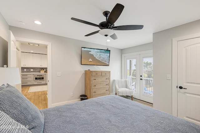 bedroom with light wood-type flooring, ceiling fan, french doors, and access to outside