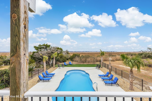 view of swimming pool featuring a fenced in pool, a fenced backyard, and a patio