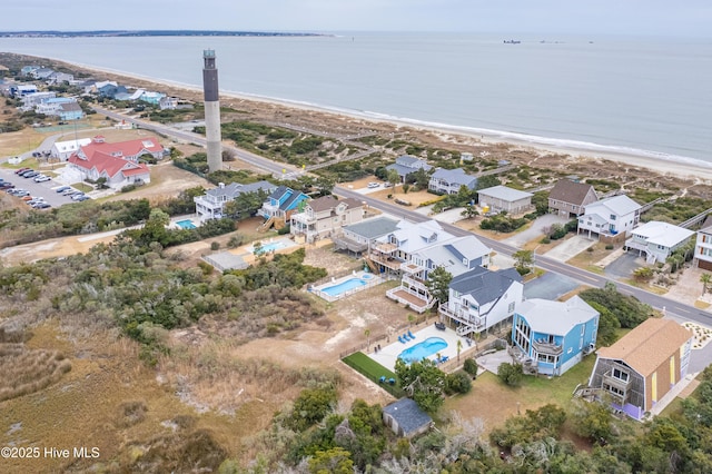 drone / aerial view with a water view and a view of the beach