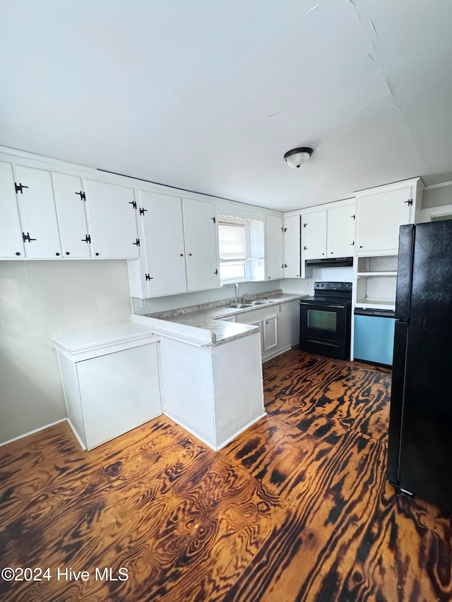 kitchen with sink, white cabinets, and black appliances