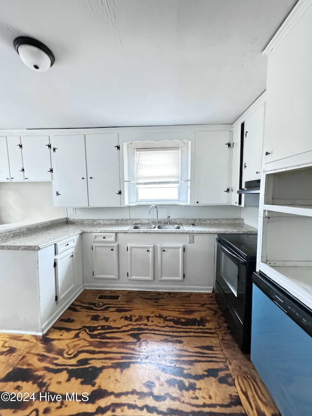 kitchen featuring black electric range and white cabinets