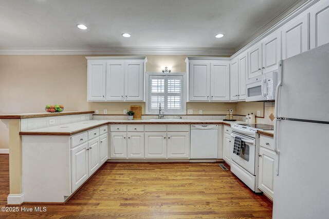 kitchen with kitchen peninsula, white cabinetry, and dishwasher