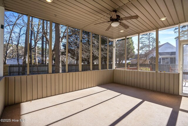 view of yard featuring a sunroom and a deck