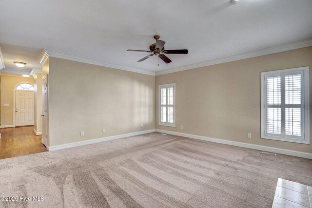 bedroom featuring ceiling fan, ornamental molding, and light carpet