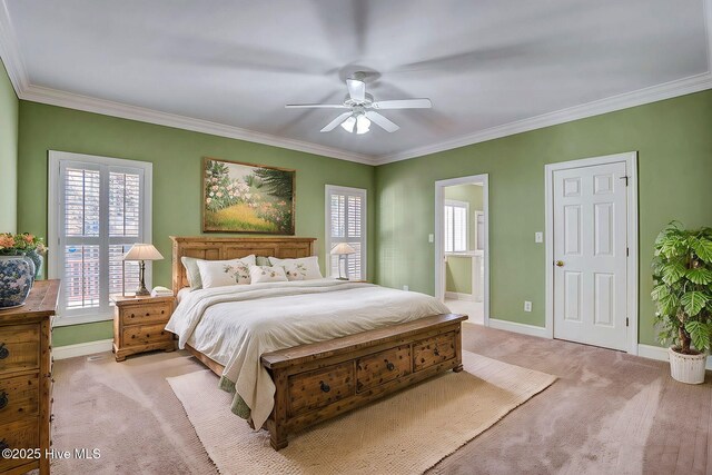 spare room with light colored carpet, ceiling fan, and crown molding