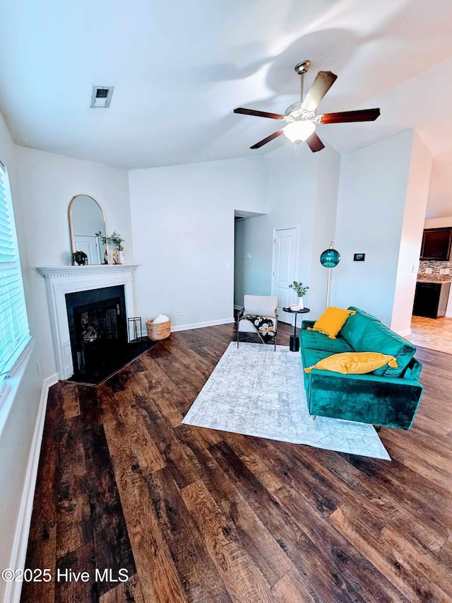 living room with hardwood / wood-style flooring and ceiling fan