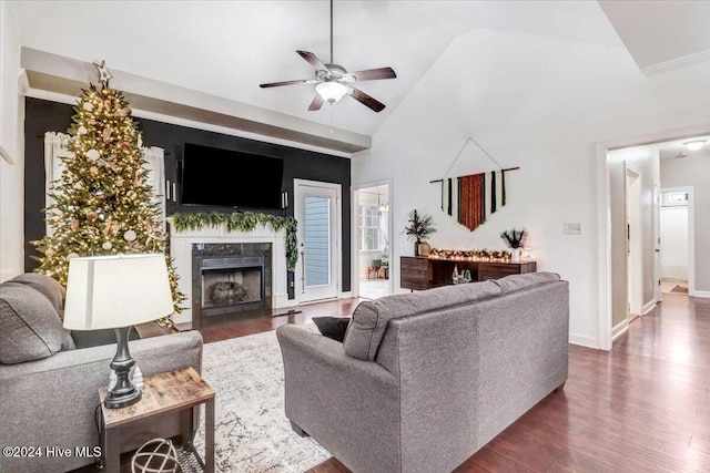 living room with a premium fireplace, high vaulted ceiling, dark wood-type flooring, and ceiling fan