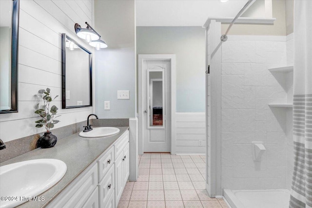 bathroom with tile patterned flooring, vanity, and a shower with curtain