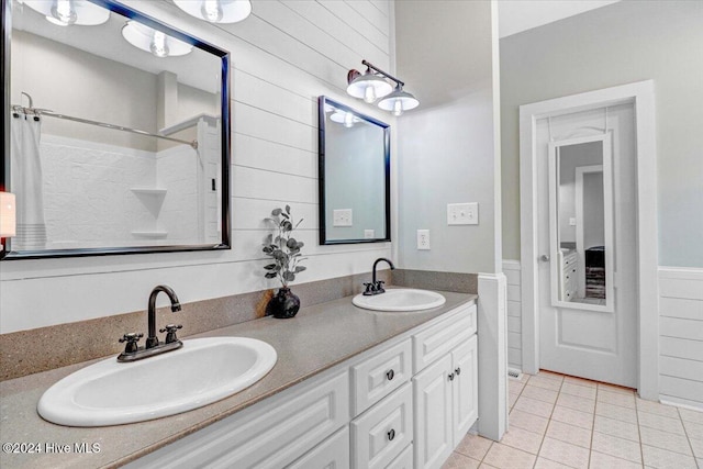 bathroom with tile patterned floors and vanity