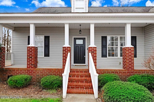 doorway to property with covered porch