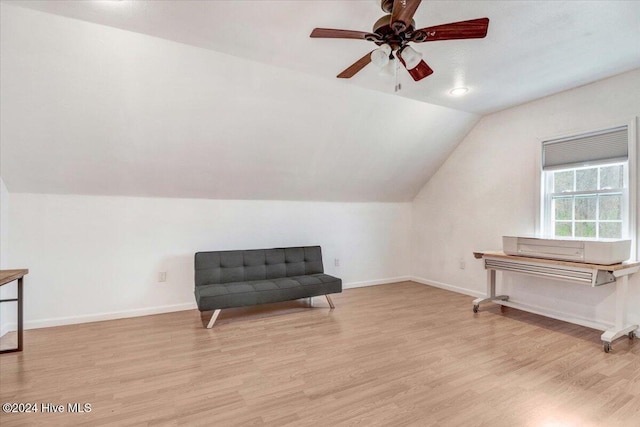 sitting room featuring light hardwood / wood-style flooring, ceiling fan, and lofted ceiling