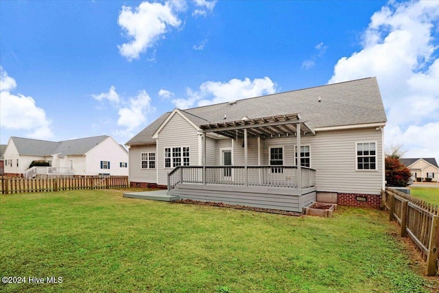 back of house featuring a lawn, a pergola, and a wooden deck