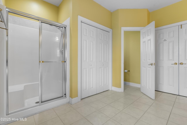 1107 Veranda Ct, Leland, NC 28451 - full bathroom with a stall shower, tile patterned flooring, a closet, and baseboards