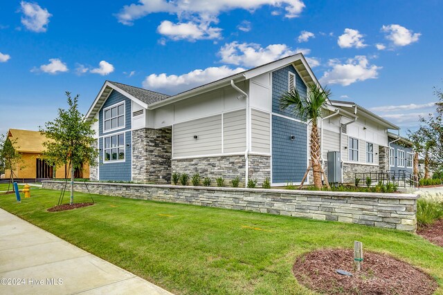 2023 Singing Palm Loop, Little River, SC 29566 - view of side of property with a yard
