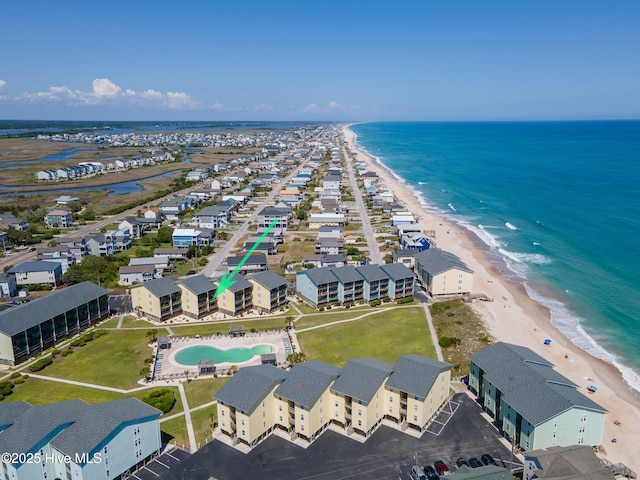 aerial view with a water view and a view of the beach