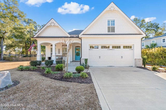 view of front of home featuring a porch and a garage