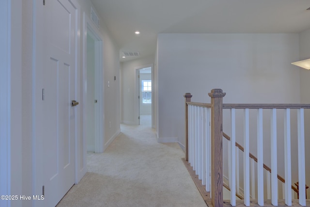 corridor with light carpet