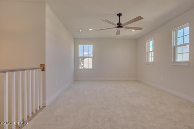 carpeted empty room with ceiling fan