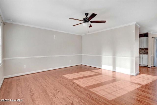 spare room featuring ceiling fan, light hardwood / wood-style flooring, and ornamental molding