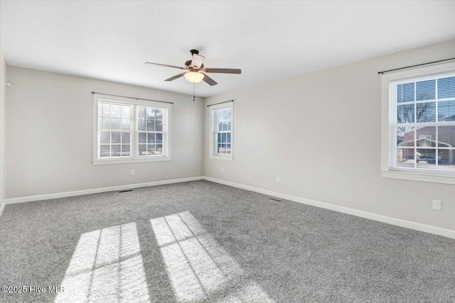 spare room with carpet floors and ceiling fan