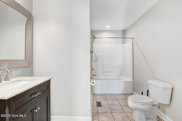 full bathroom with tile patterned floors, washtub / shower combination, vanity, and toilet