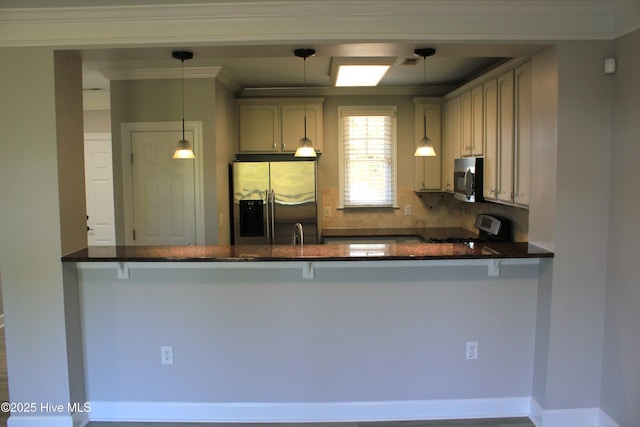 kitchen featuring backsplash, decorative light fixtures, kitchen peninsula, and stainless steel appliances