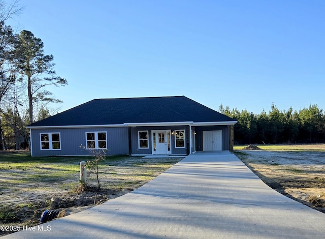 ranch-style house with a front yard and a porch