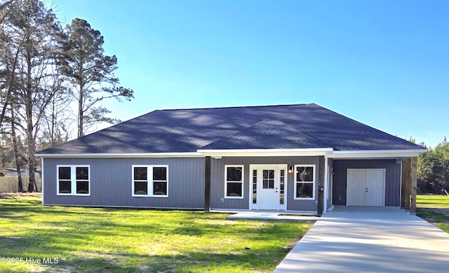 2587 Grifton Hugo Rd, Hookerton, NC 28538 - ranch-style home with driveway, a shingled roof, a front lawn, and a carport