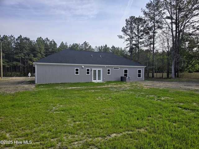 2587 Grifton Hugo Rd, Hookerton, NC 28538 - rear view of property with french doors, a lawn, dirt driveway, and cooling unit