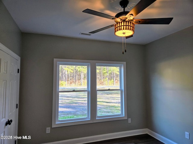 2587 Grifton Hugo Rd, Hookerton, NC 28538 - spare room featuring baseboards, dark wood-style flooring, and a ceiling fan