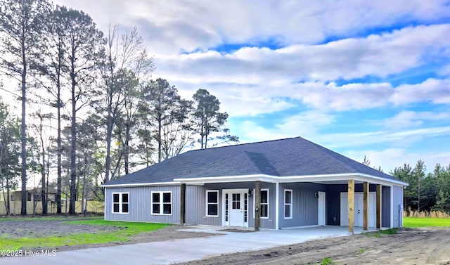 2587 Grifton Hugo Rd, Hookerton, NC 28538 - view of front of house with a porch, an attached carport, driveway, and roof with shingles