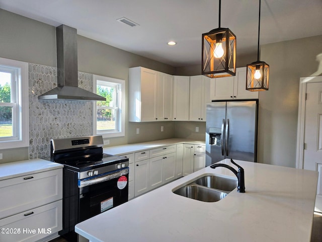 2587 Grifton Hugo Rd, Hookerton, NC 28538 - kitchen featuring stainless steel appliances, wall chimney range hood, a sink, light countertops, and decorative backsplash