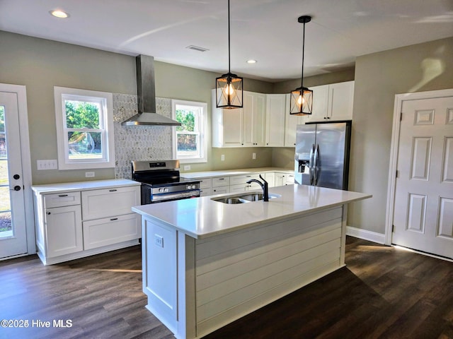 kitchen with white cabinetry, sink, stainless steel appliances, range hood, and decorative light fixtures