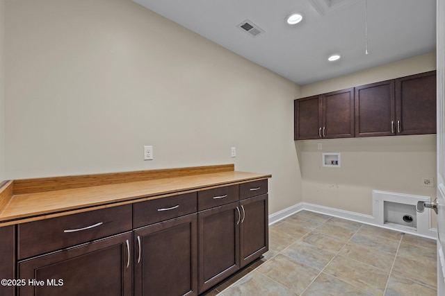 washroom featuring cabinets, washer hookup, and electric dryer hookup