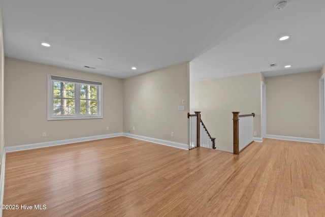 spare room with light hardwood / wood-style floors