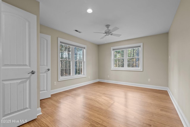 unfurnished room featuring ceiling fan and light hardwood / wood-style flooring