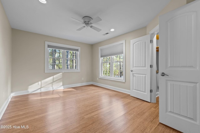 unfurnished bedroom featuring light wood-type flooring and ceiling fan